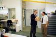 Rein Guise (directeur) rijkt een cadeau uit aan Jos van den Berg (jubileum?)